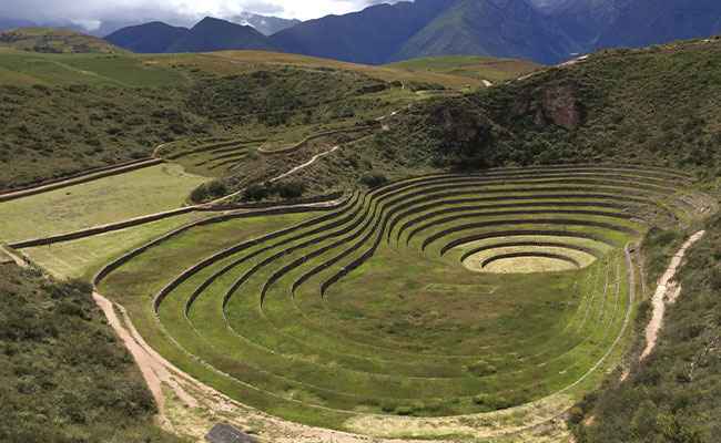 Sacred Valley Tour Peru 2 Days with camping in the Andes Mountains, exploring Inca ruins, hiking through stunning landscapes, visiting traditional Quechua communities, and enjoying local Peruvian food under the stars